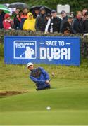 6 July 2019; Liam Johnston of Scotland chips out of the bunker onto the 18th green during day three of the 2019 Dubai Duty Free Irish Open at Lahinch Golf Club in Lahinch, Clare. Photo by Ramsey Cardy/Sportsfile