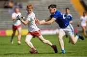 6 July 2019; James Garrity of Tyrone in action against Michael Muldoon of Cavan during the EirGrid Ulster GAA Football U20 Championship semi-final match between Cavan and Tyrone at St. Tiernach's Park in Clones, Monaghan. Photo by Oliver McVeigh/Sportsfile