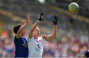 6 July 2019; Seán Óg McAleer of Tyrone in action against Cormac Timoney of Cavan during the EirGrid Ulster GAA Football U20 Championship semi-final match between Cavan and Tyrone at St. Tiernach's Park in Clones, Monaghan. Photo by Ben McShane/Sportsfile