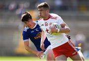 6 July 2019; Michael Conroy of Tyrone in action against Cormac Timoney of Cavan during the EirGrid Ulster GAA Football U20 Championship semi-final match between Cavan and Tyrone at St. Tiernach's Park in Clones, Monaghan. Photo by Ben McShane/Sportsfile