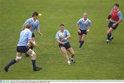 30 October 2003; Ireland out-half Ronan O'Gara passes to lock Paul O'Connell, watched by team-mates Donnacha O'Callaghan, Peter Stringer and Reggie Corrigan during squad training. 2003 Rugby World Cup, Irish squad training, Whitton Oval, Melbourne, Victoria, Australia. Picture credit; Brendan Moran / SPORTSFILE *EDI*