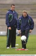 30 October 2003; Ireland coach Eddie O'Sullivan solos a gaelic football watched by Alan Quinlan after squad training. 2003 Rugby World Cup, Irish squad training, Whitton Oval, Melbourne, Victoria, Australia. Picture credit; Brendan Moran / SPORTSFILE *EDI*