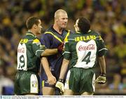 31 October 2003; Sean Marty Lockhart tries to stop Barry Hall from pushing Graham Canty. Foster's International Rules, Australia v Ireland, Second test, Melbourne Cricket Ground, Melbourne, Victoria, Australia. Picture credit; Ray McManus / SPORTSFILE *EDI*