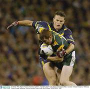 31 October 2003; Thomas Freeman, Ireland, is tackled by Australia's Jared Crouch. Foster's International Rules, Australia v Ireland, Second test, Melbourne Cricket Ground, Melbourne, Victoria, Australia. Picture credit; Ray McManus / SPORTSFILE *EDI*