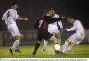 1 November 2003; Alan Kirby, Longford Town, in action against Shelbourne's Thomas Morgan and Jim Crawford, before Referee Alan Kelly abandoned the game due to a waterlogged pitch. eircom League Premier Division, Longford Town v Shelbourne, Flancare Park, Longford. Soccer. Picture credit; David Maher / SPORTSFILE *EDI*