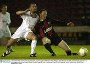 1 November 2003; Sean Francis, Longford Town, in action against Shelbourne's Dave Rodgers, before Referee Alan Kelly abandoned the game due to a waterlogged pitch. eircom League Premier Division, Longford Town v Shelbourne, Flancare Park, Longford. Soccer. Picture credit; David Maher / SPORTSFILE *EDI*