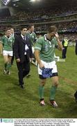 1 November 2003; David Humphreys, Ireland, holds his head after defeat to Australia as he leaves the field with team-mates, from left, Ronan O'Gara, Victor Costello, Paddy Wallace and Malcolm O'Kelly. 2003 Rugby World Cup, Pool A, Ireland v Australia, Telstra Dome, Melbourne, Victoria, Australia. Picture credit; Brendan Moran / SPORTSFILE *EDI*