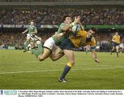 1 November 2003; Shane Horgan, Ireland, catches above the head of Joe Roff, Australia, before just failing to touch down for a try. 2003 Rugby World Cup, Pool A, Ireland v Australia, Telstra Dome, Melbourne, Victoria, Australia. Picture credit; Brendan Moran / SPORTSFILE *EDI*