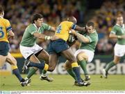 1 November 2003; Wendell Sailor, Australia, is tackled by Irish players Kevin Maggs and Shane Horgan. 2003 Rugby World Cup, Pool A, Ireland v Australia, Telstra Dome, Melbourne, Victoria, Australia. Picture credit; Ray McManus / SPORTSFILE *EDI*