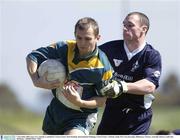 2 November 2003; Gary Cox of Ireland is tackled by Karl Dowling of Victoria State during theInternational Challange match between Victoria State and Ireland at Gaelic Park in Keysborough, Melbourne, Victoria, Australia. Photo by Ray McManus/Sportsfile