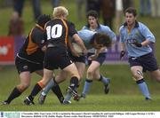 1 November 2003; Tom Carter, UCD, is tackled by Buccaneer's David Connellan,10, and Gareth Halligan. AIB League Division 1, UCD v Buccaneers, Belfield, UCD, Dublin. Rugby. Picture credit; Matt Browne / SPORTSFILE *EDI*