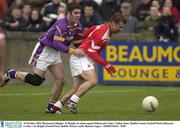 19 October 2003; Raymond Gallagher, St Brigids, in action against Kilmacud Crokes' Nathan Kane. Dublin County Football Final, Kilmacud Crokes v St. Brigids, Parnell Park, Dublin. Picture credit; Damien Eagers / SPORTSFILE *EDI*