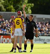 15 June 2013; Referee Brian Gavin, right, issues a red card to Andrew Shore, Wexford. Leinster GAA Hurling Senior Championship Quarter-Final Replay, Dublin v Wexford, Parnell Park, Dublin. Picture credit: Ray McManus / SPORTSFILE