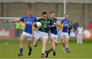 15 June 2013; Peadar Byrne, Meath, is tackled by Darragh O'Sullivan, and Paul Earls, Wicklow. Leinster GAA Football Senior Championship Quarter-Final, Wicklow v Meath, County Grounds, Aughrim, Co. Wicklow. Picture credit: Matt Browne / SPORTSFILE