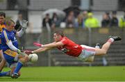 16 June 2013; Daniel Goulding, Cork, and Clare goalkeeper Joe Hayes contest a loose ball. Munster GAA Football Senior Championship Semi-Final, Clare v Cork, Cusack Park, Ennis, Co. Clare. Picture credit: Matt Browne / SPORTSFILE