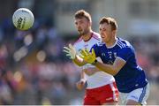 6 July 2019; Jason McLoughlin of Cavan in action against Brian Kennedy of Tyrone during the GAA Football All-Ireland Senior Championship Round 4 match between Cavan and Tyrone at St. Tiernach's Park in Clones, Monaghan. Photo by Ben McShane/Sportsfile