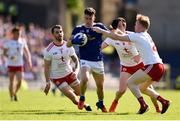 6 July 2019; Dara McVeety of Cavan in action against Tyrone players, from left, Ronan McNamee, Colm Cavanagh, and Hugh Pat McGeary during the GAA Football All-Ireland Senior Championship Round 4 match between Cavan and Tyrone at St. Tiernach's Park in Clones, Monaghan. Photo by Ben McShane/Sportsfile