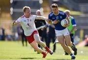 6 July 2019; Conor Madden of Cavan in action against Hugh Pat McGeary of Tyrone during the GAA Football All-Ireland Senior Championship Round 4 match between Cavan and Tyrone at St. Tiernach's Park in Clones, Monaghan. Photo by Ben McShane/Sportsfile