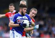 6 July 2019; Daniel O'Reilly of Laois in action against Sean White of Cork during the GAA Football All-Ireland Senior Championship Round 4 match between Cork and Laois at Semple Stadium in Thurles, Tipperary. Photo by Matt Browne/Sportsfile