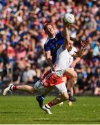 6 July 2019; Matthew Donnelly of Tyrone in action against Ciaran Brady of Cavan during the GAA Football All-Ireland Senior Championship Round 4 match between Cavan and Tyrone at St. Tiernach's Park in Clones, Monaghan. Photo by Oliver McVeigh/Sportsfile