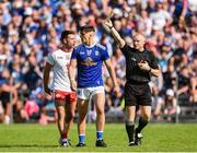 6 July 2019; Darren McCurry of Tyrone and  Barry Fortune of Cavan are both issued with yellow cards by Referee Barry Cassidy during the GAA Football All-Ireland Senior Championship Round 4 match between Cavan and Tyrone at St. Tiernach's Park in Clones, Monaghan. Photo by Oliver McVeigh/Sportsfile
