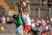 6 July 2019; Ben McDonnell of Tyrone wins possession over Cavan goalkeeper Raymond Galligan on his way to scoring his side's first goal during the GAA Football All-Ireland Senior Championship Round 4 match between Cavan and Tyrone at St. Tiernach's Park in Clones, Monaghan. Photo by Ben McShane/Sportsfile