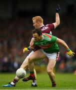 6 July 2019; Darren Coen of Mayo in action against Declan Kyne of Galway during the GAA Football All-Ireland Senior Championship Round 4 match between Galway and Mayo at the LIT Gaelic Grounds in Limerick. Photo by Eóin Noonan/Sportsfile