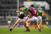 6 July 2019; Kevin McLoughlin of Mayo in action against Seán Kelly, left and John Daly of Galway during the GAA Football All-Ireland Senior Championship Round 4 match between Galway and Mayo at the LIT Gaelic Grounds in Limerick. Photo by Eóin Noonan/Sportsfile