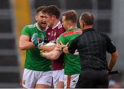 6 July 2019; Michael Daly of Galway with Aidan O’Shea and Donal Vaughan of Mayo during the GAA Football All-Ireland Senior Championship Round 4 match between Galway and Mayo at the LIT Gaelic Grounds in Limerick. Photo by Brendan Moran/Sportsfile