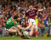 6 July 2019; Ian Burke of Galway is fouled by Chris Barrett of Mayo resulting in a penalty during the GAA Football All-Ireland Senior Championship Round 4 match between Galway and Mayo at the LIT Gaelic Grounds in Limerick. Photo by Eóin Noonan/Sportsfile