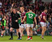 6 July 2019; Declan Kyne of Galway is shown a yellow card by referee Joe McQuillan during the GAA Football All-Ireland Senior Championship Round 4 match between Galway and Mayo at the LIT Gaelic Grounds in Limerick. Photo by Brendan Moran/Sportsfile