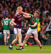 6 July 2019; Declan Kyne of Galway and Cillian O'Connor of Mayo during the GAA Football All-Ireland Senior Championship Round 4 match between Galway and Mayo at the LIT Gaelic Grounds in Limerick. Photo by Brendan Moran/Sportsfile