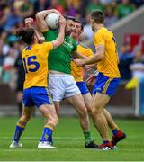 7 July 2019; Mickey Newman of Meath is tackled by Clare players, from left, Cian O'Dea, Cathal O'Connor, and Cillian Brennan during the GAA Football All-Ireland Senior Championship Round 4 match between Meath and Clare at O’Moore Park in Portlaoise, Laois. Photo by Piaras Ó Mídheach/Sportsfile