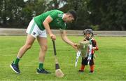 9 July 2019; Limerick hurler Aaron Gillane gives a hand to three year old Senan Ó aHannaigh, from the host club Mungret St Paul's, to carry the Liam MacCarthy cup at the GAA Hurling All Ireland Senior Championship Series National Launch at Mungret St Pauls GAA Club in Limerick. Photo by Brendan Moran/Sportsfile