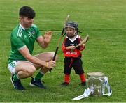 9 July 2019; Aaron Gillane of Limerick, with three year old Senan Ó aHannaigh, from the host club, with the Liam MacCarthy Cup in attendance at the GAA Hurling All Ireland Senior Championship Series National Launch at Mungret St Pauls GAA Club in Limerick Photo by Ray McManus/Sportsfile