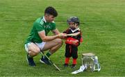 9 July 2019; Aaron Gillane of Limerick, with three year old Senan Ó aHannaigh, from the host club, with the Liam MacCarthy Cup in attendance at the GAA Hurling All Ireland Senior Championship Series National Launch at Mungret St Pauls GAA Club in Limerick Photo by Ray McManus/Sportsfile