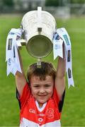 9 July 2019; Mattie Rice, five years, from the host club, lifts the Liam MacCarthy Cup at the GAA Hurling All Ireland Senior Championship Series National Launch at Mungret St Pauls GAA Club in Limerick Photo by Ray McManus/Sportsfile