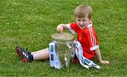 9 July 2019; John Coyne, seven years, a member of the host club, with the Liam MacCarthy Cup at the GAA Hurling All Ireland Senior Championship Series National Launch at Mungret St Pauls GAA Club in Limerick Photo by Ray McManus/Sportsfile