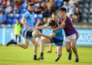 9 July 2019; Brian O'Leary of Dublin is tackled by Dylan McVeigh of Wexford during the EirGrid Leinster GAA Football U20 Championship semi-final match between Dublin and Wexford at Parnell Park in Dublin. Photo by Eóin Noonan/Sportsfile