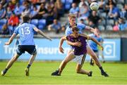 9 July 2019; Liam Coleman of Wexford is tackled by Peadar O'Cofaigh Byrne of Dublin during the EirGrid Leinster GAA Football U20 Championship semi-final match between Dublin and Wexford at Parnell Park in Dublin. Photo by Eóin Noonan/Sportsfile