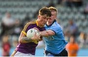 9 July 2019; Jamue Myler of Wexford in action against Eoin O'Dea of Dublin during the EirGrid Leinster GAA Football U20 Championship semi-final match between Dublin and Wexford at Parnell Park in Dublin. Photo by Eóin Noonan/Sportsfile