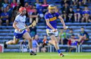 9 July 2019; Conor Bowe of Tipperary gets past Sam Fitzgerald of Waterford on his way to scoring his side's second goal during the Bord Gáis Energy Munster GAA Hurling Under 20 Championship Semi-Final match between Tipperary and Waterford at Semple Stadium in Thurles, Tipperary. Photo by Piaras Ó Mídheach/Sportsfile
