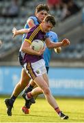 9 July 2019; Enda Minouge of Wexford in action against Niall O'Leary of Dublin during the EirGrid Leinster GAA Football U20 Championship semi-final match between Dublin and Wexford at Parnell Park in Dublin. Photo by Eóin Noonan/Sportsfile