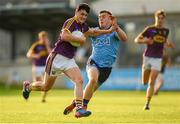 9 July 2019; Micheal Molloy of Wexford in action against Neil Matthews of Dublin during the EirGrid Leinster GAA Football U20 Championship semi-final match between Dublin and Wexford at Parnell Park in Dublin. Photo by Eóin Noonan/Sportsfile