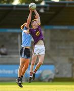 9 July 2019; Liam Coleman of Wexford in action against Donal Ryan of Dublin during the EirGrid Leinster GAA Football U20 Championship semi-final match between Dublin and Wexford at Parnell Park in Dublin. Photo by Eóin Noonan/Sportsfile