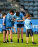 9 July 2019; Brian O'Leary of Dublin signs an autograph for a young supporter following the EirGrid Leinster GAA Football U20 Championship semi-final match between Dublin and Wexford at Parnell Park in Dublin. Photo by Eóin Noonan/Sportsfile