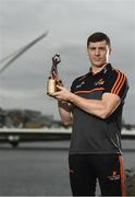 10 July 2019; The PwC GAA/GPA Players of the Month for June, footballer Jamie Brennan of Donegal, and hurler, Diarmuid O’Keeffe of Wexford, were at PwC offices in Dublin today to pick up their respective awards. The players were joined by Billy Sweetman, PwC Wexford, Leinster GAA Chairman, Jim Bolger, and GPA Chief Executive, Paul Flynn. Pictured is Jamie Brennan of Donegal with his award at PwC Spencer Dock, North Wall Quay, Dublin 1.  Photo by Sam Barnes/Sportsfile