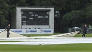 10 July 2019; The covers are put back on after a pitch inspection during a rain shower before the T20 International match between Ireland and Zimbabwe at Stormont in Belfast. Photo by Piaras Ó Mídheach/Sportsfile