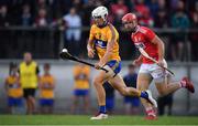 10 July 2019; Aidan McCarthy of Clare in action against Declan Hanlon of Cork during the Bord Gais Energy Munster GAA Hurling Under 20 Championship semi-final match between Cork and Clare at Páirc Ui Rinn in Cork. Photo by Brendan Moran/Sportsfile