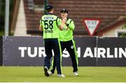 12 June 2019; Lorcan Tucker of Ireland, centre, being congratulated by Shane Getkate after taking a catch for a wicket during the 2nd T20 Cricket International match between Ireland and Zimbabwe at Bready Cricket Club in Magheramason, Co. Tyrone. Photo by Oliver McVeigh/Sportsfile